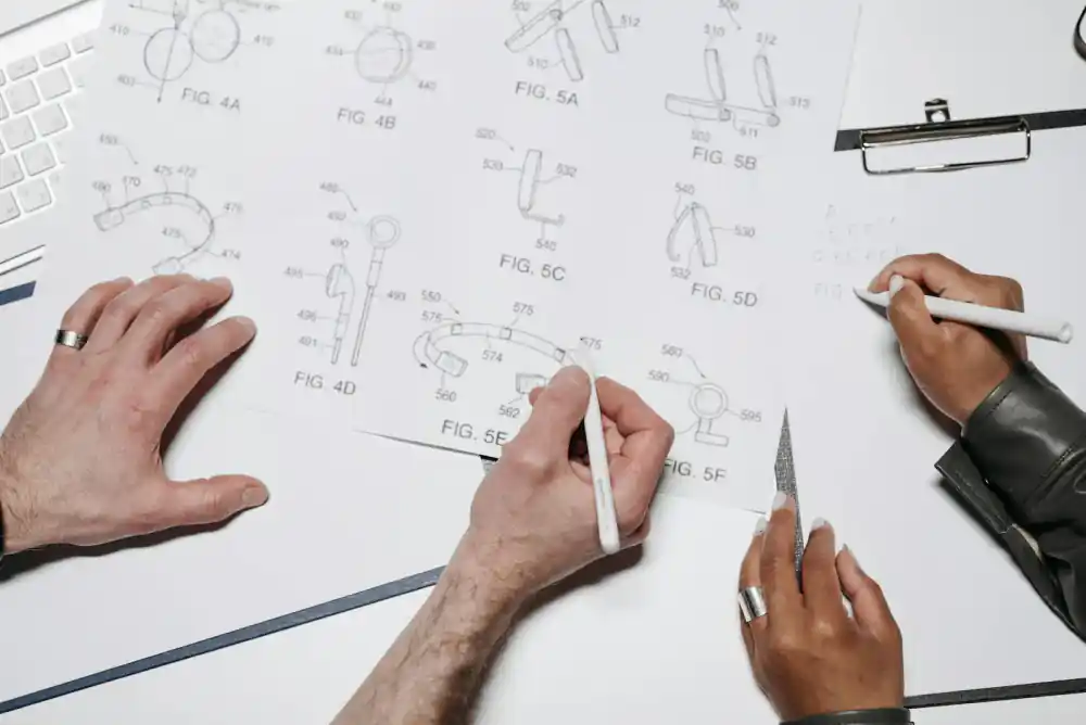 Designers collaborating on desk prototypes