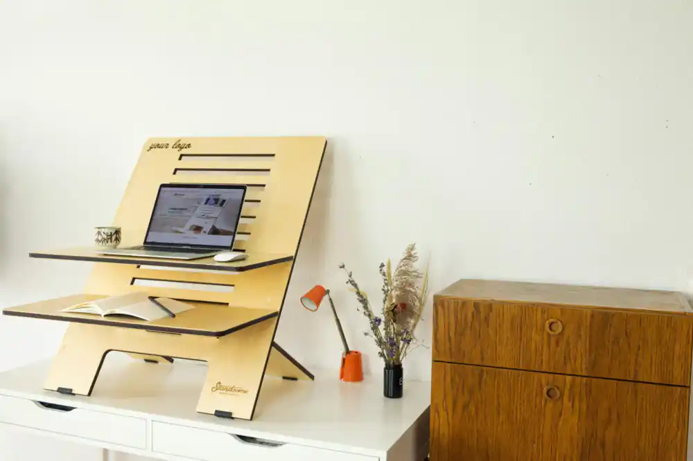 Designer working at a DeskRise desk with matte finish
