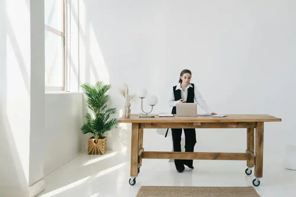 Person standing at a desk with good posture